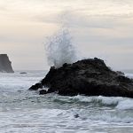 Surf breaking on rock