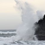 Surf breaking on rock